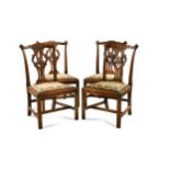 A set of four George III mahogany dining chairs,