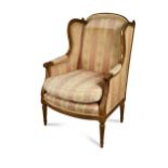 A French wing back chair, 19th century,