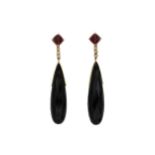 A pair of onyx, garnet and diamond ear pendants,