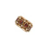 A late 20th century garnet and split pearl ring,
