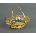 An early George III silver gilt swing handled bon bon basket,