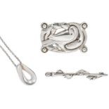 Georg Jensen - A pendant and chain and a brooch, together with one other brooch,