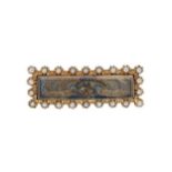 A 19th century hairwork and pearl memorial brooch,