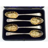 A set of four George III 18th century silver tablespoons with later decoration,