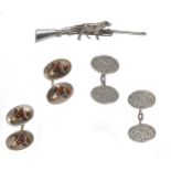 Two pairs of cufflinks and a gun dog pin,