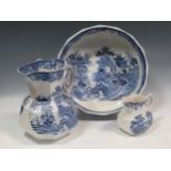 A Mason's blue and white willow pattern wash jug and bowl, and another jug