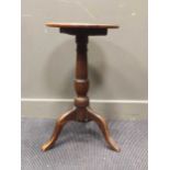 A small 19th century oak tripod table with circular top, 72 x 40cm, together with a nest of four