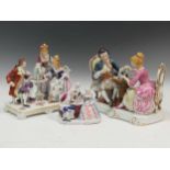 Three Continental porcelain models of figures in antique dress playing chess (3)