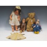 A teddy bear, felt head doll, stuffed toy monkey and a composition doll