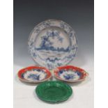 A blue and white charger decorated with two roosters in a landscape (A/F) together with a moulded