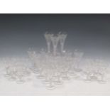 A set of 29 air-twist drinking glasses, with trumpet bowls engraved with fruiting vines and two