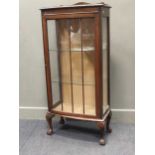 A glazed door bowfronted display cabinet on short cabriole legs 126 x 59 x 32cm