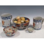 Two late 18th century Chinese export tankards, together with three Imari bowls, a collection of