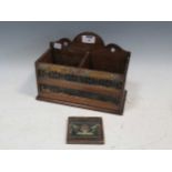 A small letter box with brass labels, 'Post' and 'Delivery', with a small decorative plaque