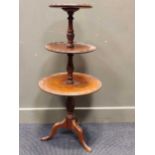 A mahogany circular three tier dumb waiter in 18th century style, 108cm high