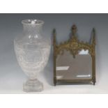 A small Gothic style gilt metal frame mirror and a cut glass vase