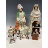 Staffordshire ceramics, including the Vicar & Moses, a flat back figure of Queen Victoria, another