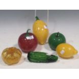 A small collection of Murano glass fruits, including a cucumber, apple and lemon