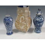 Two Chinese blue & white vases, 19th century; and a white laquer vase (3)Condition report: Fading