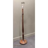 A mahogany standard lamp 175cm high