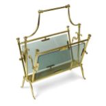 A 1970s brass and glass magazine rack,