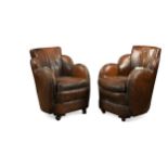 A pair of Art Deco leather cloud-back armchairs,