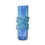 A tall turquoise glass chimney vase,