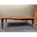 A Victorian mahogany extending dining table with two leaves, 72 x 239 x 127cm extended