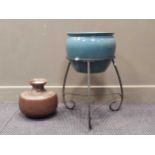 A blue ceramic jardinere on wrought iron stand 60cm high including stand, together with a embossed