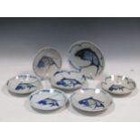 A set of Chinese blue and white plates decorated with fish, largest 23cm diameter (7)