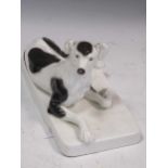 A Goldscheider figure of a reclining dog, 14.5 x 12 x 25.5cm