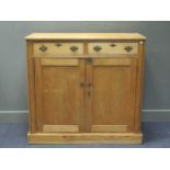 An early 20th century pine two drawer cupboard 109 x 117 x 56cm