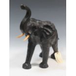 A leather model of an elephant 48 x 56 x 29cm