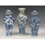 Three Chinese blue and white vases, 31cm high (3)The larger white vase has some markings to the