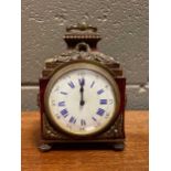 A 19th century faux Tortoiseshell and gilt metal mounted clock, the enamel dial with Roman chapter