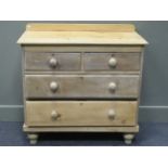 A pine chest of two short over two long drawers on turned feet 86 x 89 x 44.5cm together with a pine