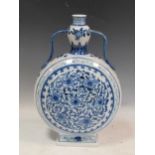 A Chinese blue and white moon flask with floral decoration, 39cm highKiln grit from glazing on spout