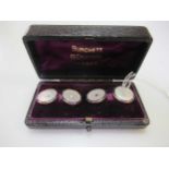A pair of enamel and mother of pearl cufflinks (one split pearl lacking), stamped '18CT', gross