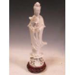 A Chinese Blanc de Chine model of Guanyin, 39cm including base