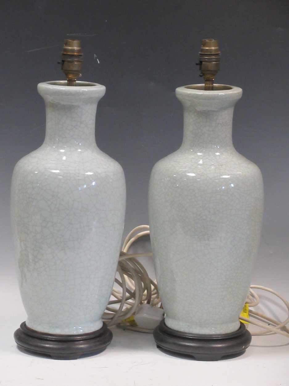 A pair of light blue crackle glazed ceramic lamps on wooden bases, 46cm high (2)Collection of dust