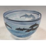 Attributed to Malcolm Sutcliffe, a small glass bowl decorated with dolphins 10.5cm high and 16cm