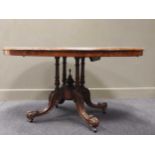 A Victorian burr walnut loo table, the crossbanded oval top upon four fluted and turned column