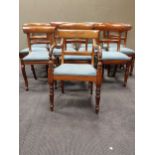 A matched set of twelve Regency and later mahogany bar back dining chairs, to include one carver (
