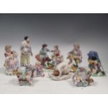 A collection of mainly Continental figural ceramics to include a Capodimonte figure of a rollling