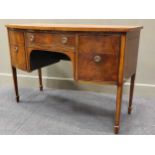 A Regency style mahogany bowfront sideboard comprising of five drawers raised on square tappered