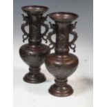 A pair of Japanese Meiji bronze vases, 25cm high