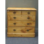 A late Victorian pine chest of two short over three long drawers with brass swan neck handles 97 x