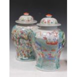 A pair of Chinese modern famille verte vases and covers, decorated with figures in a boat and