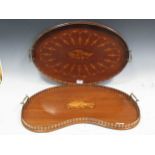 An Edwardian two-handled inlaid tray, 60cm wide; another kidney shaped tray inlaid with musical