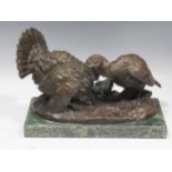 A bronze brace of Turkeys, signed 'Bazan', on a green stone base, 23 x 33 x 18cm, including base